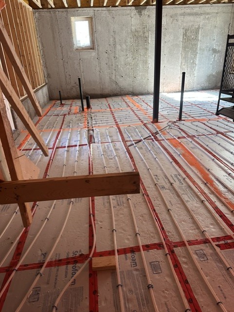Radiant floor heating tubing laid out before a slab pour.