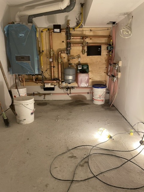 Mechanical room supplying a hydronic snow melt system.