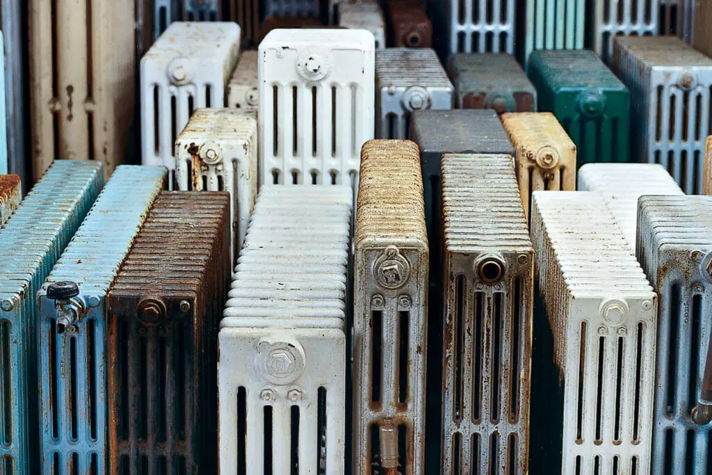 A row of vintage cast iron radiators.